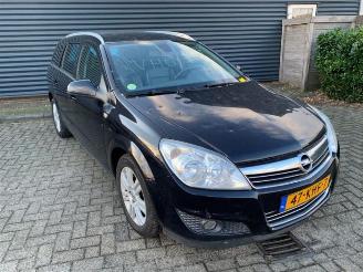 Damaged car Opel Astra Astra H SW (L35), Combi, 2004 / 2014 1.6 16V Twinport 2009/11